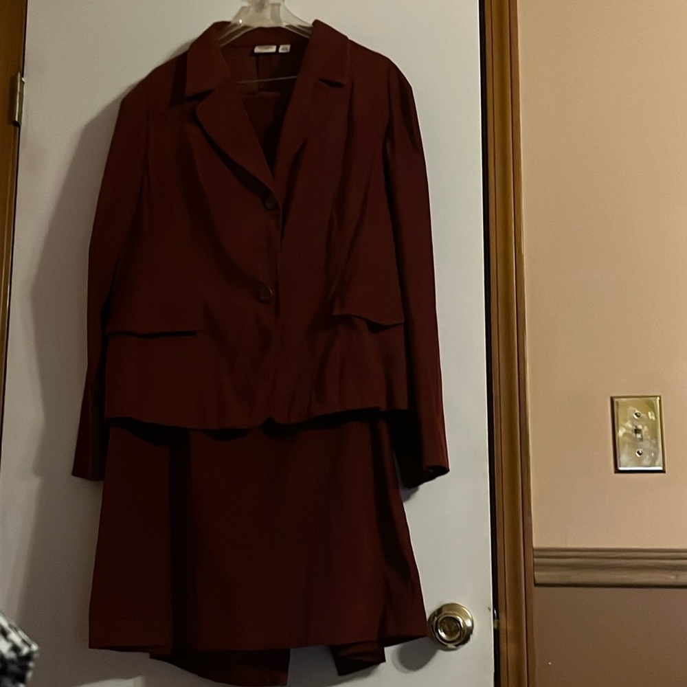 Burgundy suede like skirt suit .
